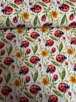 100% Cotton, Ladybugs and Flowers on a Dark Ecru Background